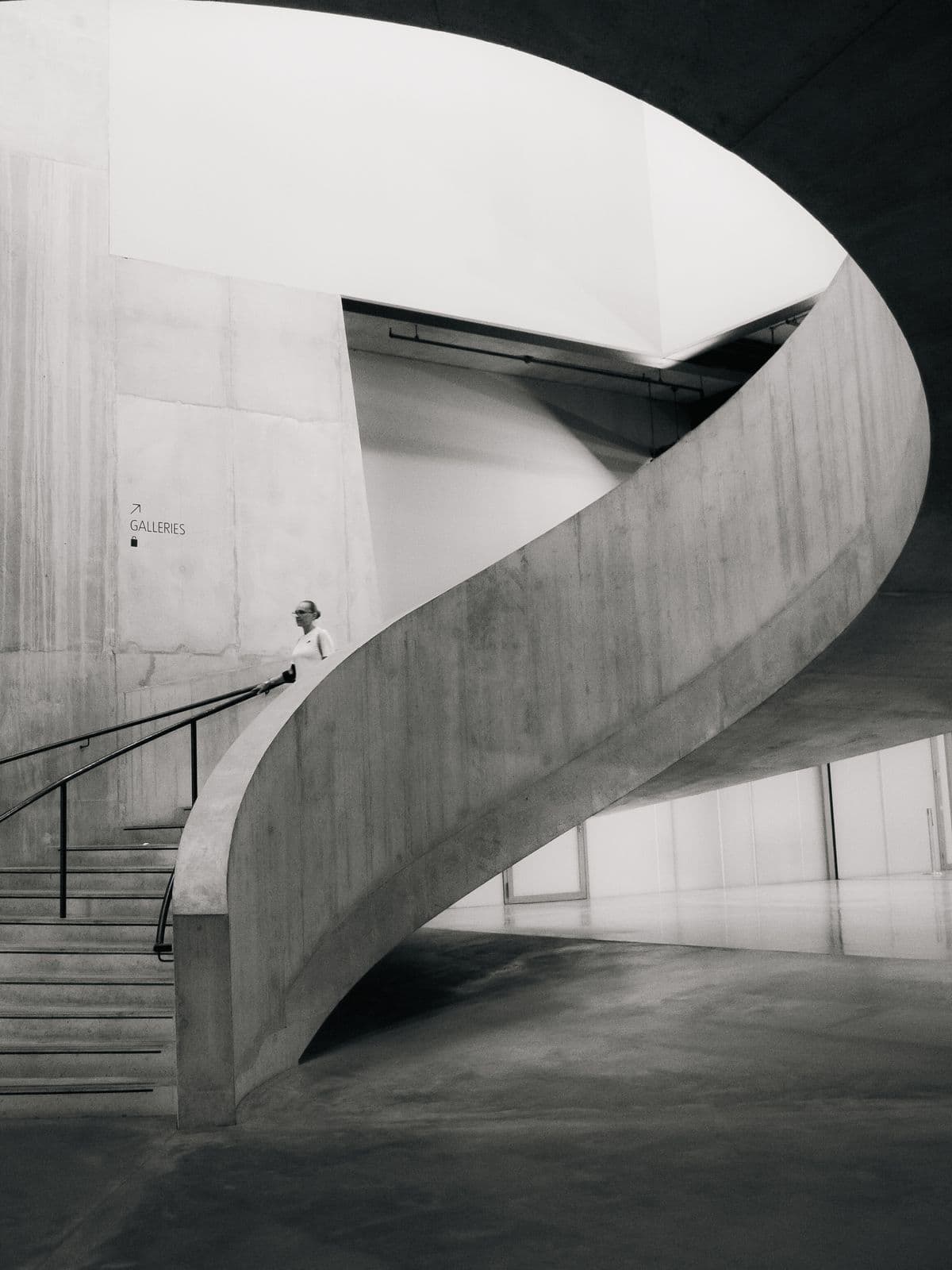 A concrete spiral staircase photographed in black and white